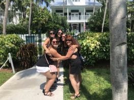 Bachelorette group hugging outside during a party scavenger hunt