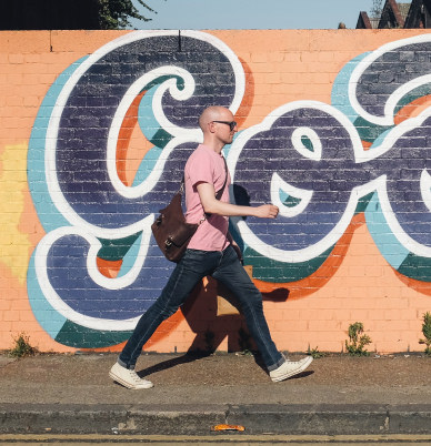Close-up view of a vibrant mural during an art walk